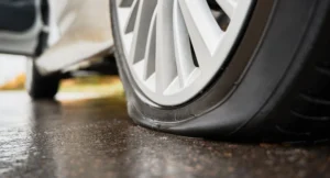 car tyres replacement, A close-up image of a flat tyre