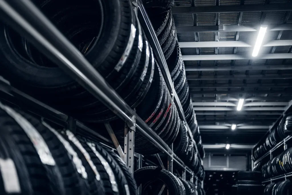 Best tyre shop Singapore with a wide selection of quality car tyres displayed in a professional warehouse.