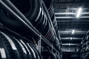 Best tyre shop Singapore with a wide selection of quality car tyres displayed in a professional warehouse.